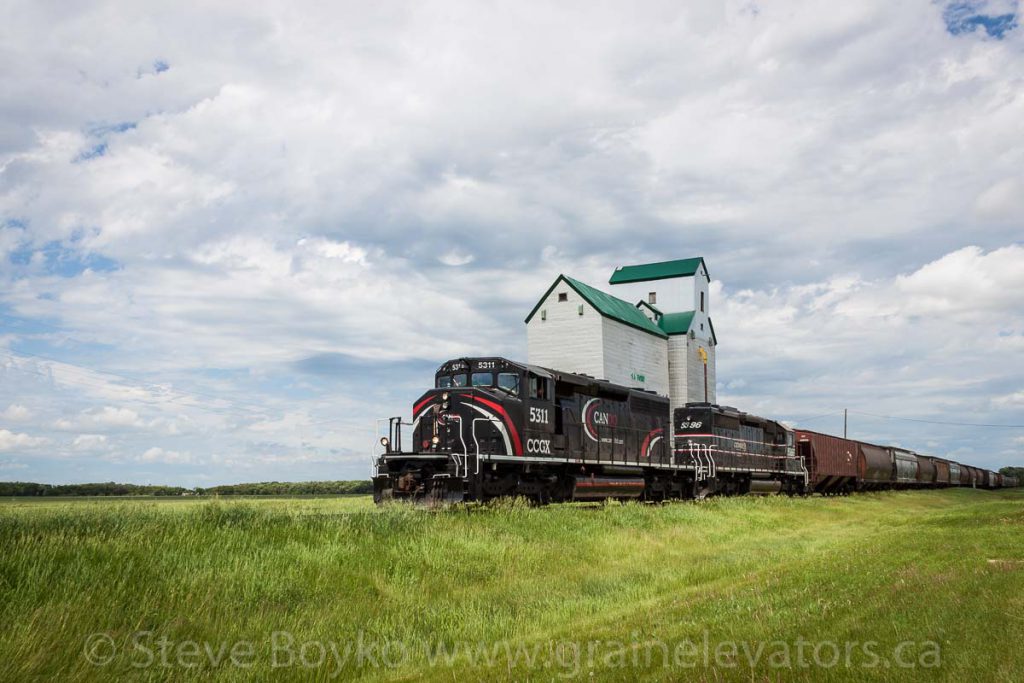 CEMR 5311 passing the Sanford, MB grain elevator, June 2015. Contributed by Steve Boyko.