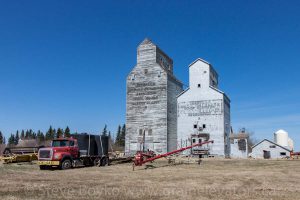 Two old wooden grain elevators in the small town of Isabella, MB.