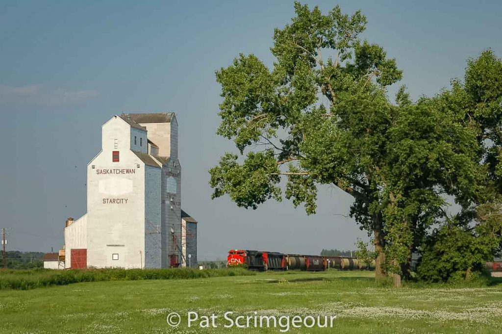 Train passing Star City, SK grain elevator, June 2006. Contributed by Pat Scrimgeour.