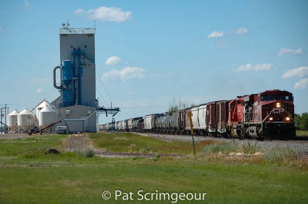 Train passing the Yellow Grass, SK grain elevator, July 2008. Contributed by Pat Scrimgeour.