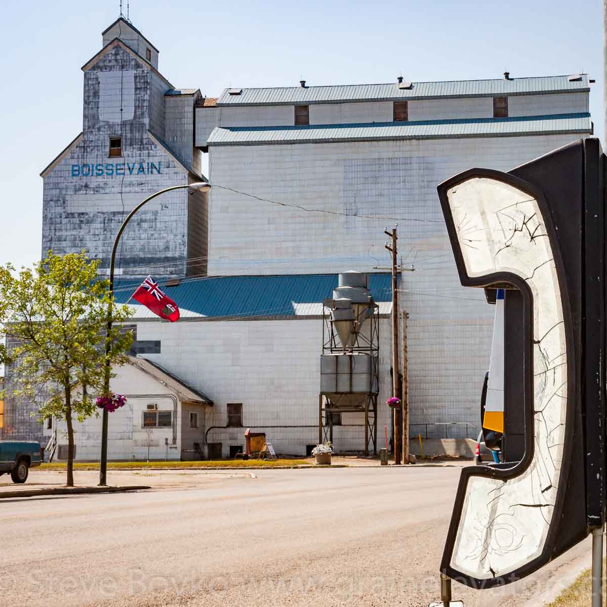 Telephone and ex UGG grain elevator, Boissevain, MB. Aug 2014. Contributed by Steve Boyko.