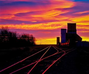 Grain elevator sunrise at Ponteix, SK. Copyright by Bob St. Cyr.
