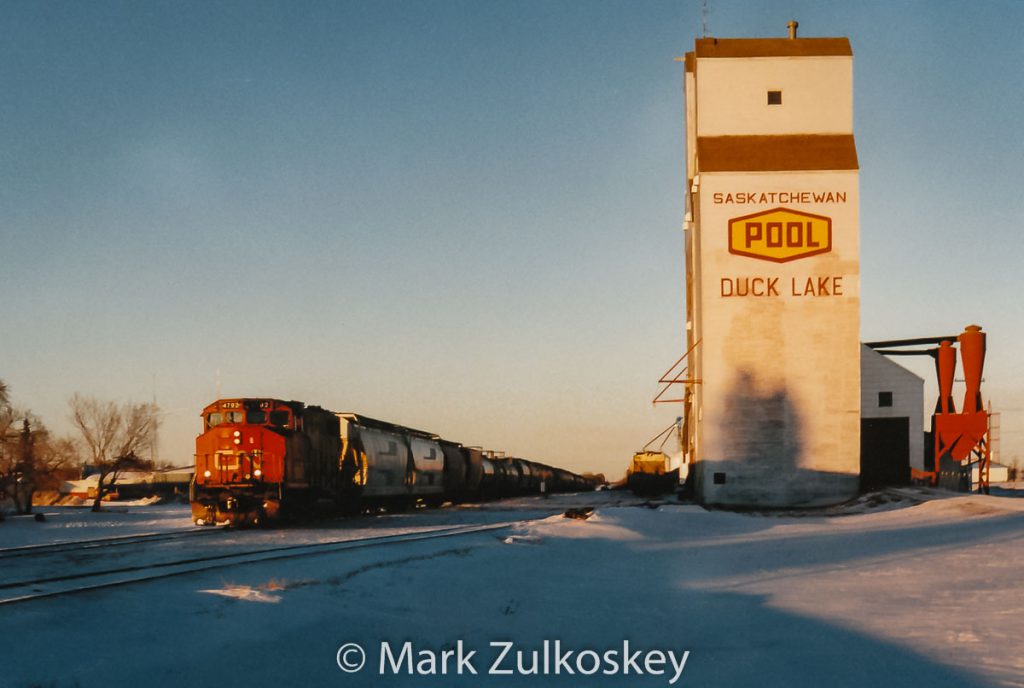 CN train and Duck Lake, SK grain elevator. Contributed by Mark Zulkoskey.