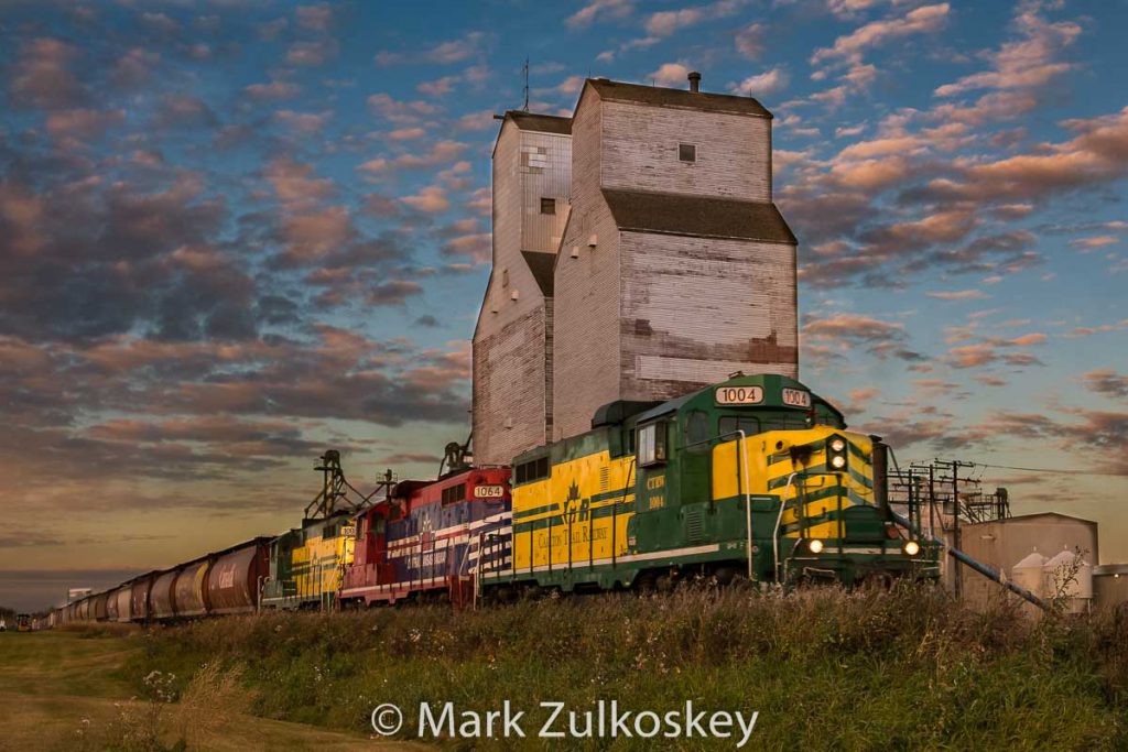 Carlton Trail Railway train passing the Duck Lake, SK grain elevator. Contributed by Mark Zulkoskey.