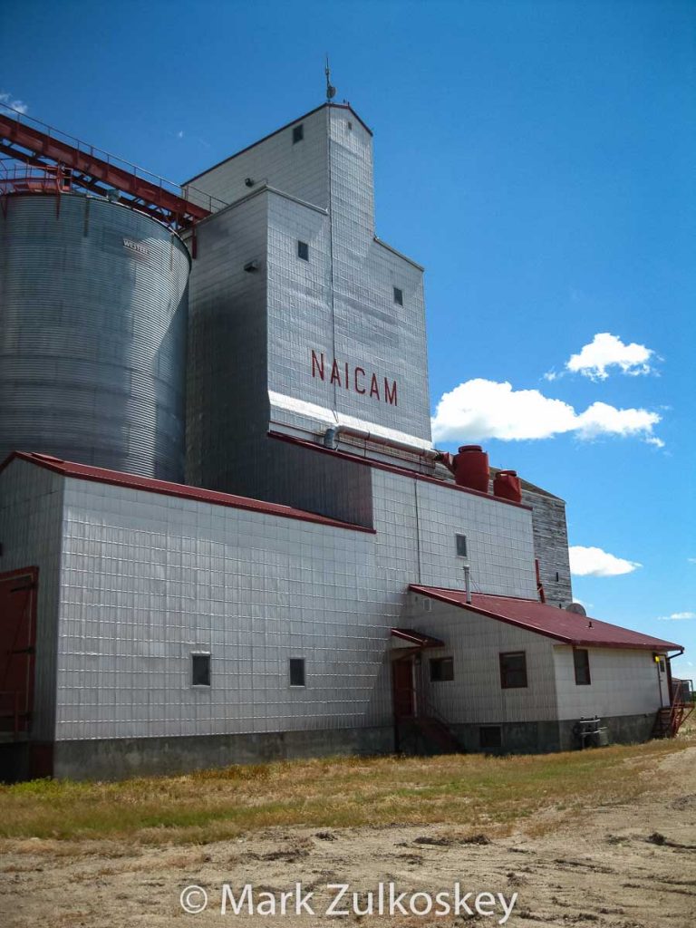 Naicam, SK grain elevator, July 2011. Contributed by Mark Zulkoskey.