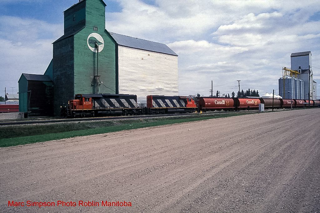 A CN train passes the former Roblin, MB grain elevator. Contributed by Marc Simpson.