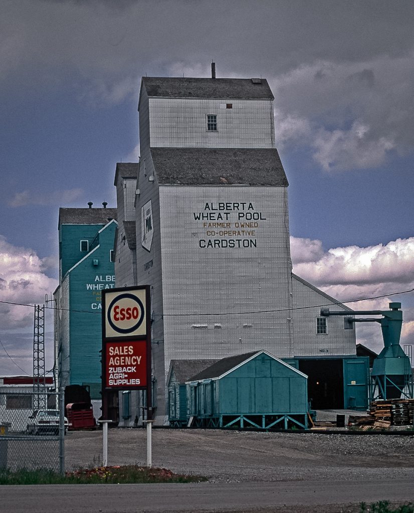 Grain elevators in Cardston, AB, May 1992. Copyright by Gary Rich.