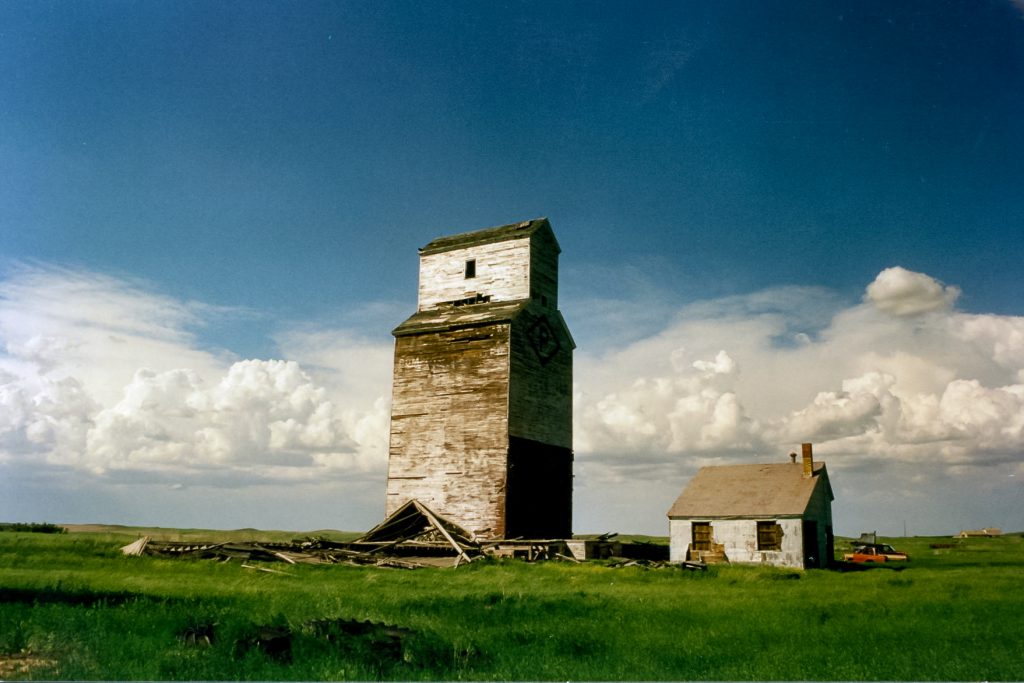 Grain elevators in Verlo, SK, June 2002. Copyright by Robert Boyd.