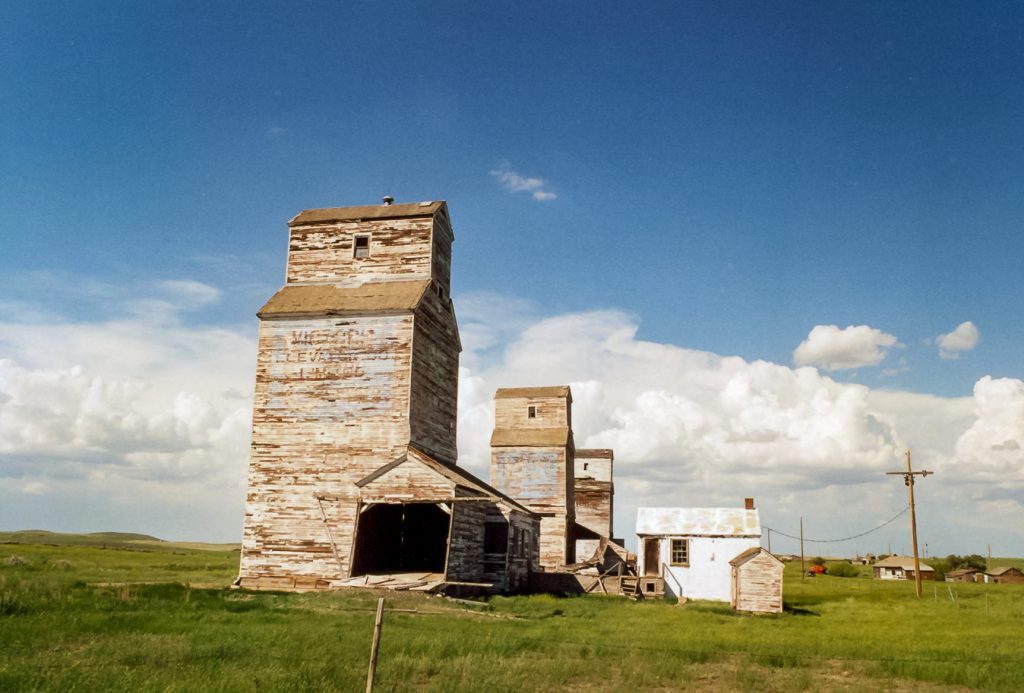 Grain elevators in Verlo, SK, June 2002. Copyright by Robert Boyd.