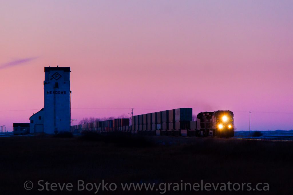 A CP train passing the Meadows, MB grain elevator, Jan 2012. Contributed by Steve Boyko.