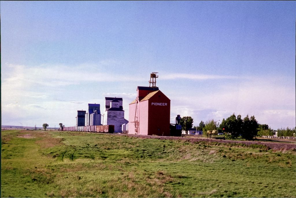 Grain elevators in Champion, AB, June 1999. Copyright by Robert Boyd.