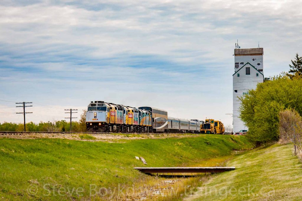 The VIA Rail "Canadian" passing the Dugald, MB grain elevator, May 2017. Contributed by Steve Boyko.