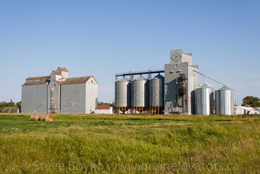 Two grain elevators in Pierson, MB, Aug 2014. Contributed by Steve Boyko.