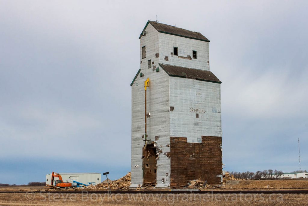 Demolition in progress on Sperling, MB grain elevator, Mar 22, 2015. Contributed by Steve Boyko.