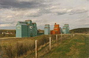 Grain elevators in Carbon, SK. Copyright by Peter Kroeger.