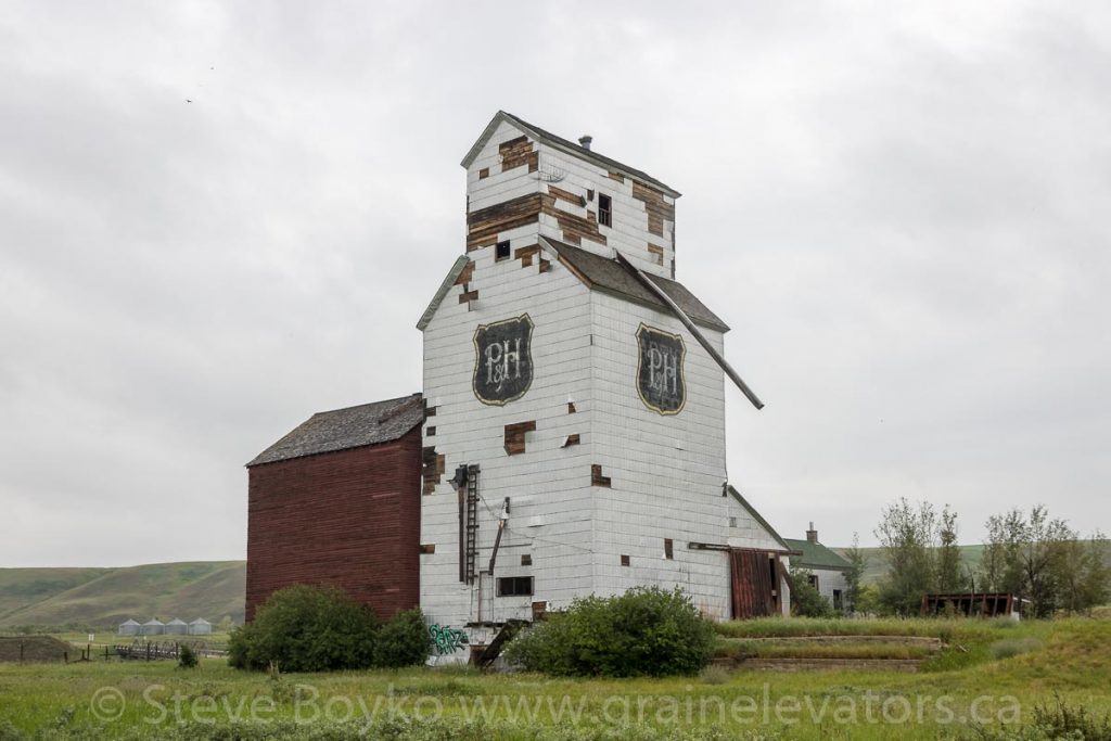 Ex Parrish & Heimbecker grain elevator in Sharples, AB, June 2018. Contributed by Steve Boyko.