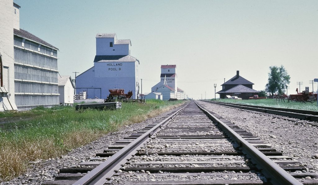 Grain elevators in Holland, MB, 1970. Copyright by Roy Leaman.