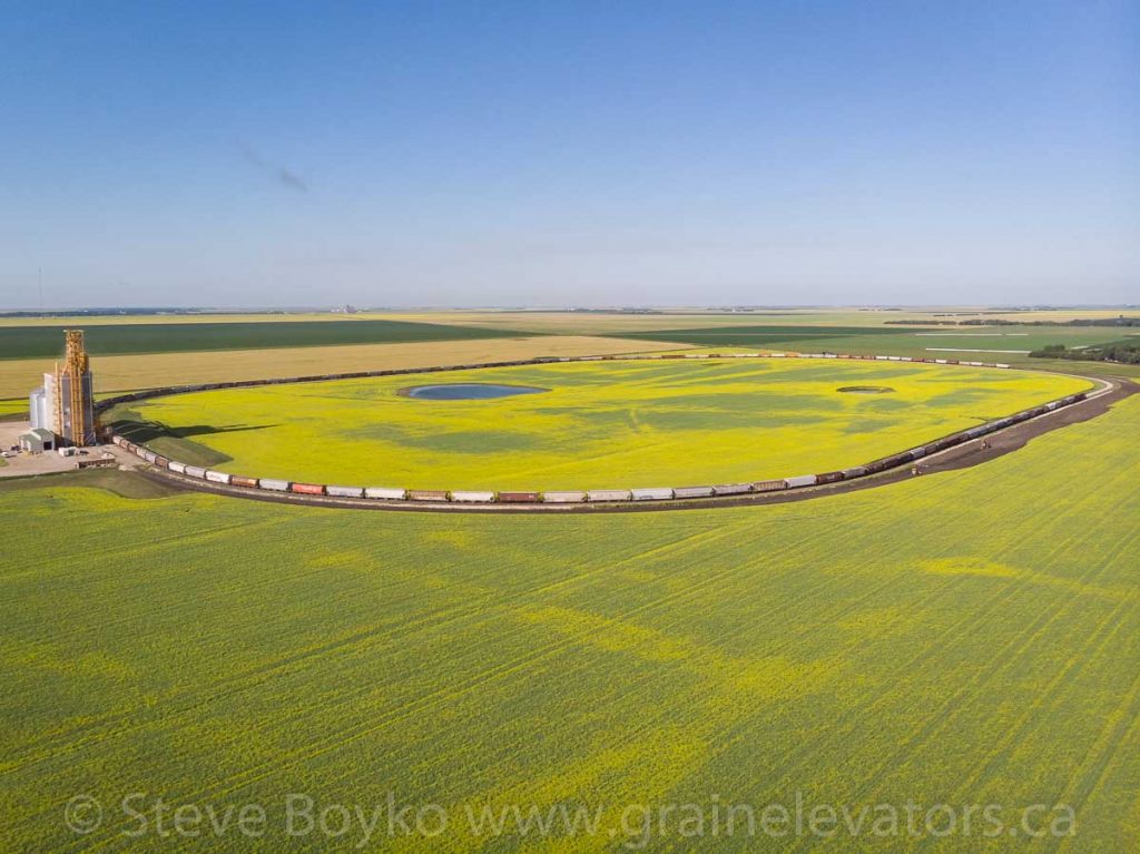 Aerial view of the G3 Glenlea grain elevator with a train loading on the loop track, July 2020.