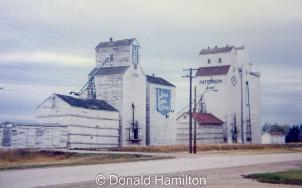 UGG and Paterson grain elevators in Kane, MB, Oct 1989. Contributed by Donald Hamilton.