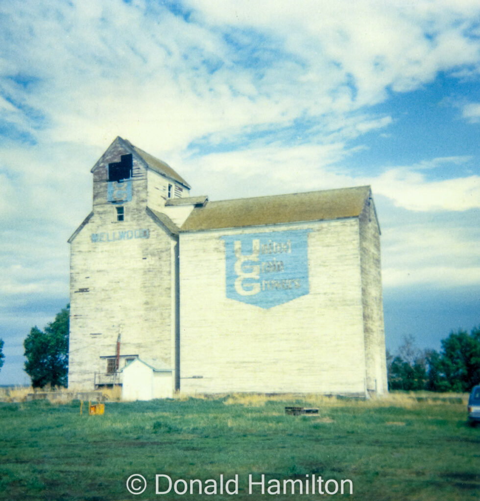 The UGG grain elevator in Wellwood, MB, April 1991. Copyright by Donald Hamilton.