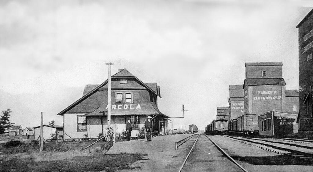 Arcola train station and grain elevators circa 1907.