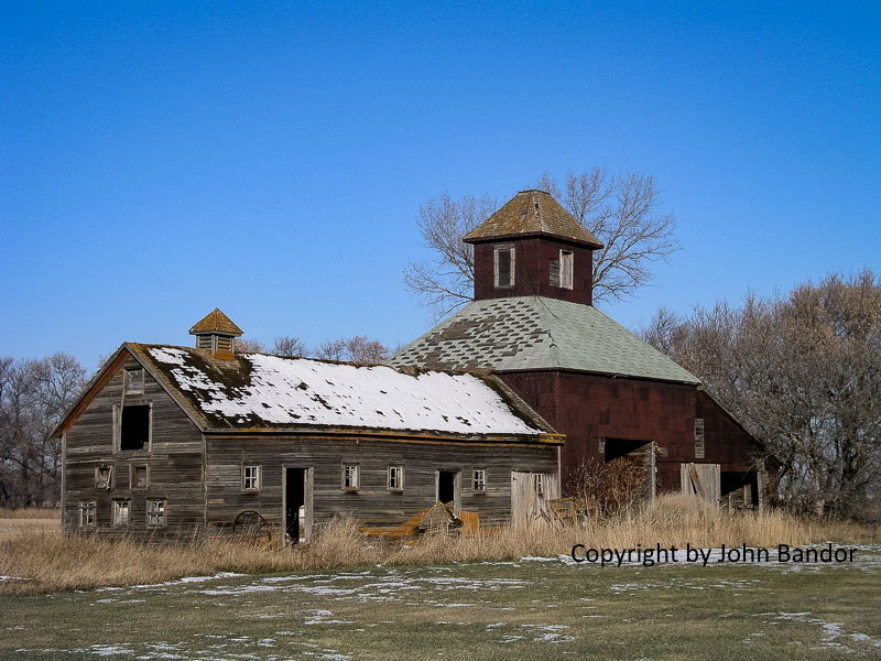 Farm elevator and barn, near Carberry, 2003. Contributed by John Bandor.