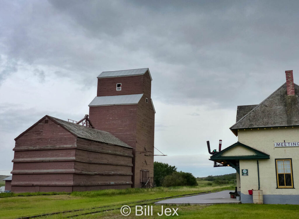 Grain elevator and train station in Meeting Creek, AB, June 2014. Contributed by Bill Jex.