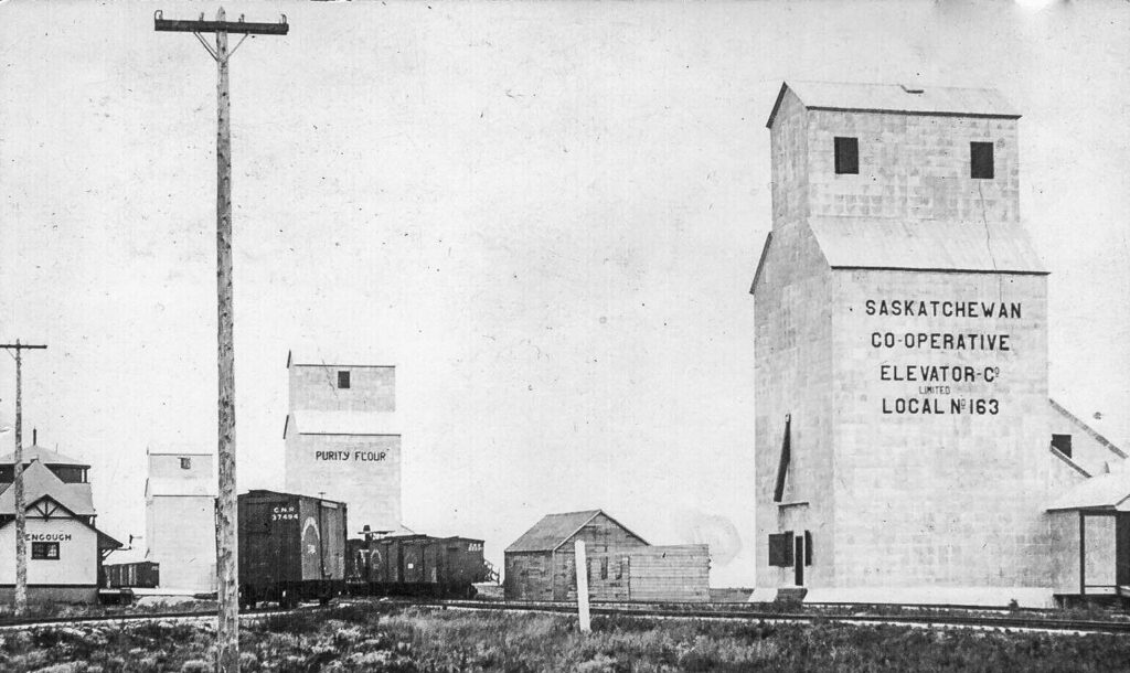 Historic postcard photo of Bengough, SK grain elevators and station