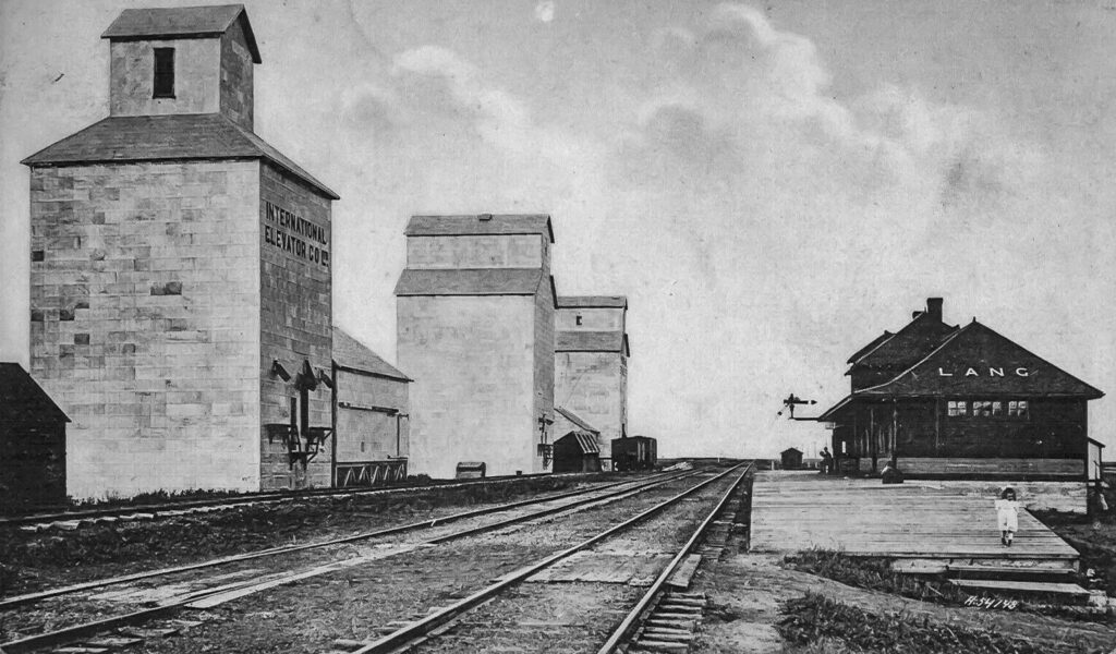 Grain elevators and train station in Lang, SK, 1909