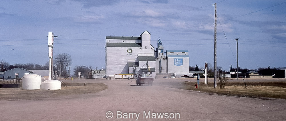 UGG and Pool grain elevators in Neepawa, MB, 1991. Contributed by Barry Mawson.