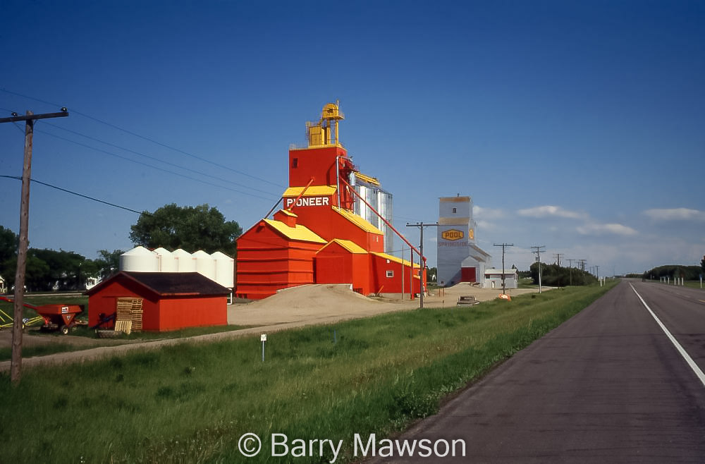 Two grain elevators in Springside, SK, 1991. Contributed by Barry Mawson.