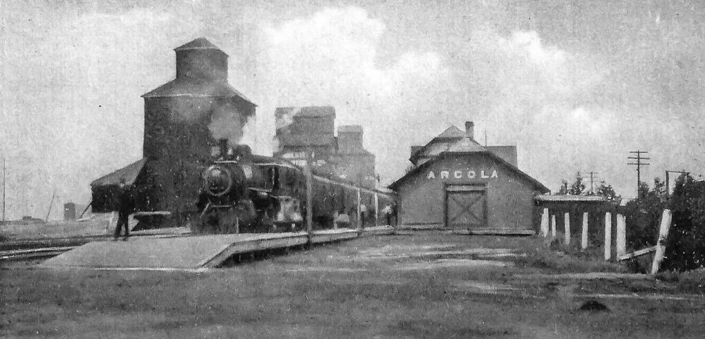 Arcola, SK train station and grain elevators circa 1920