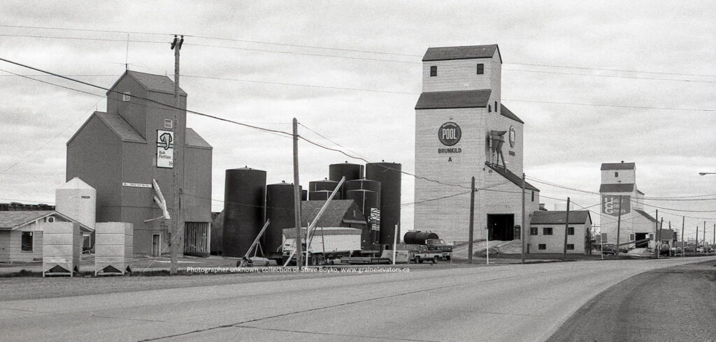 Black and white photo of grain elevators in Brunkild, MB