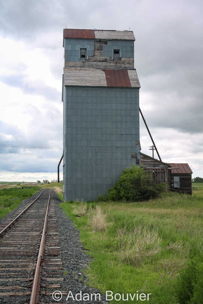 Grain elevator beside railway tracks
