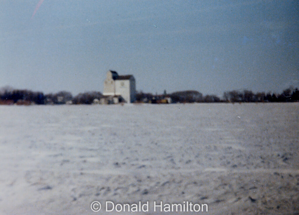 Blurry photo of grain elevator in winter