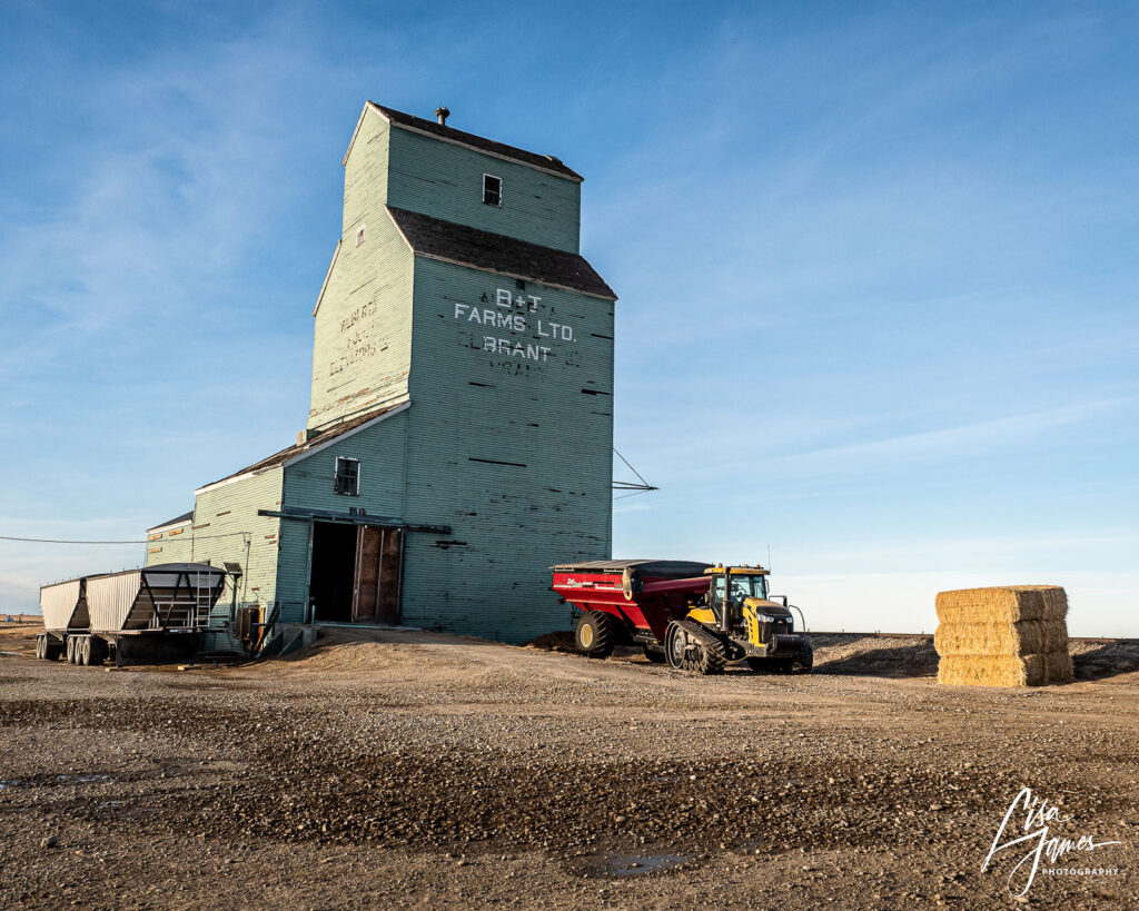 Green grain elevator and farm equipment