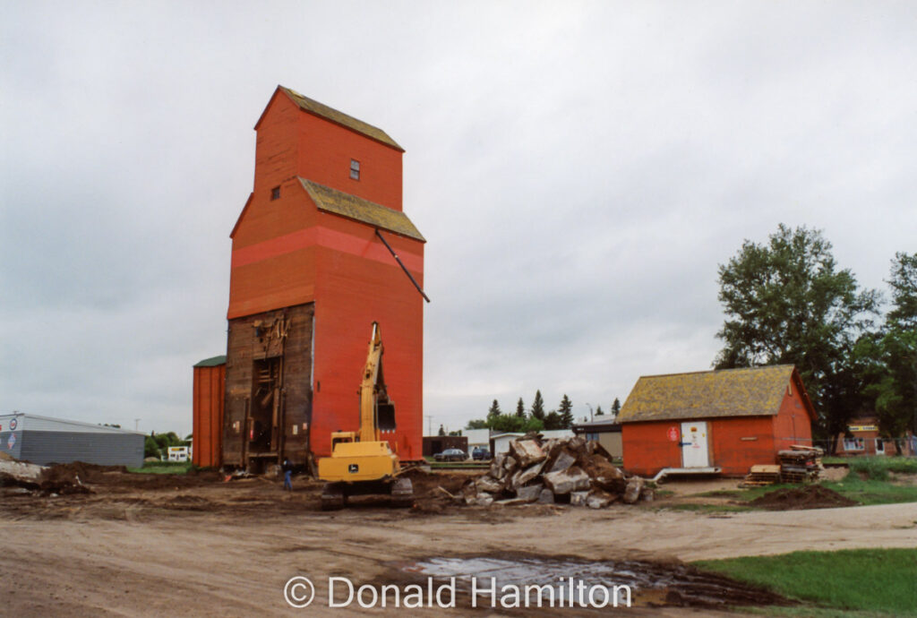 Demolition of red Pioneer grain elevator in Hague, SK