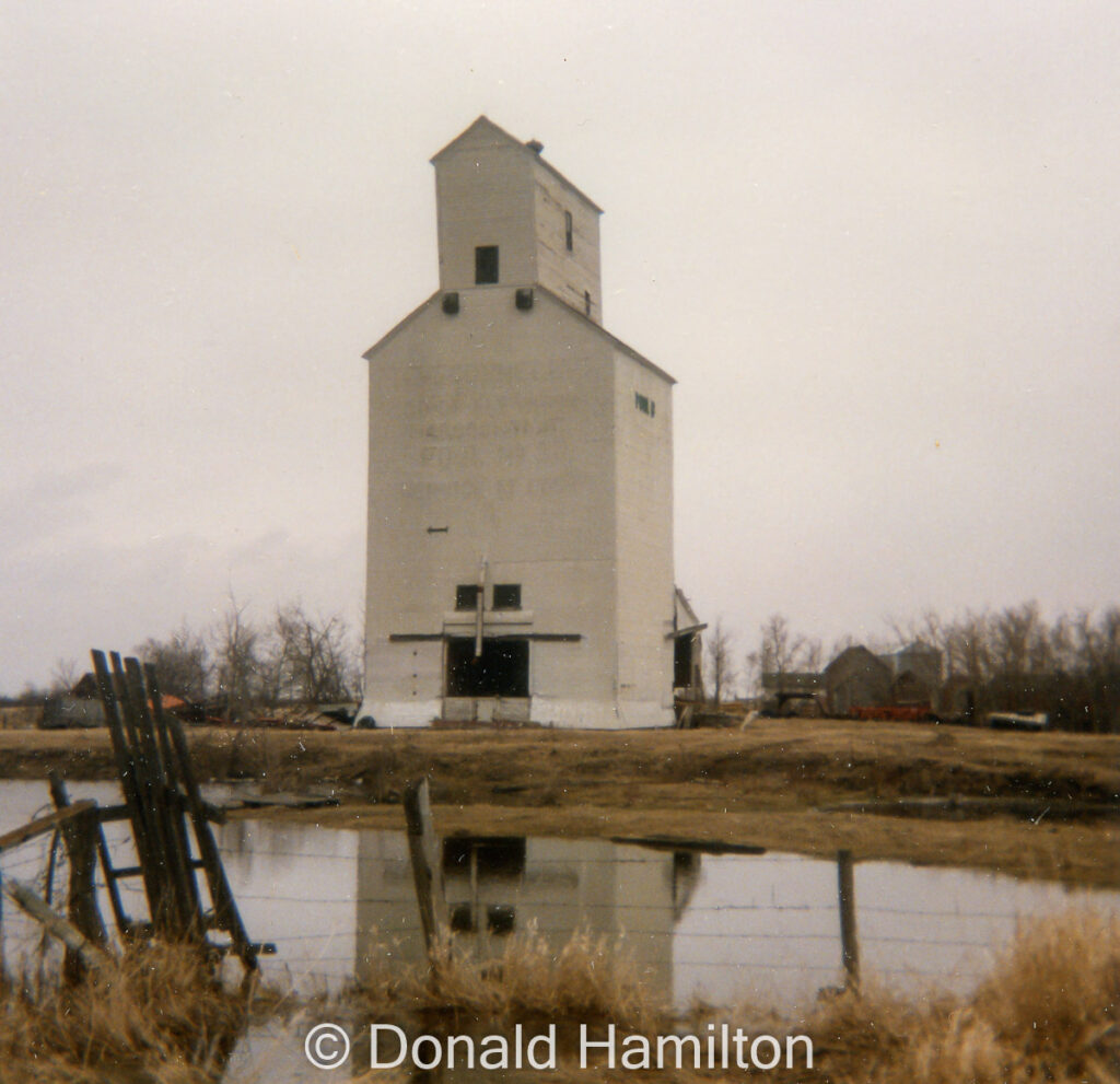 Wooden grain elevator and reflection