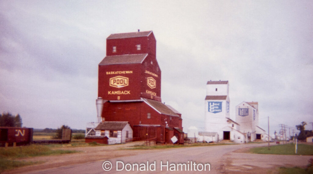Two UGG grain elevators and Pool "B" elevator in Kamsack, SK, August 1994.