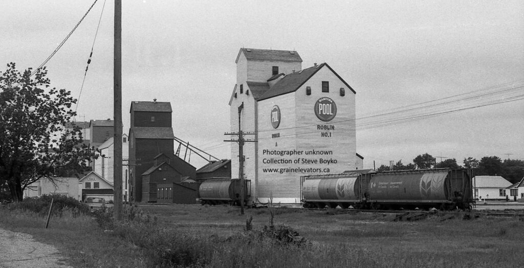 Four grain elevators in Roblin, MB, June 1980.