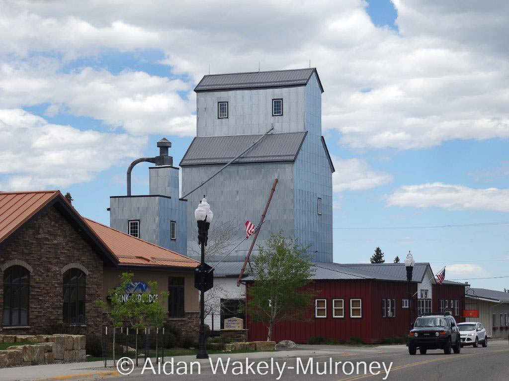 Silver grain elevator in the middle of the town