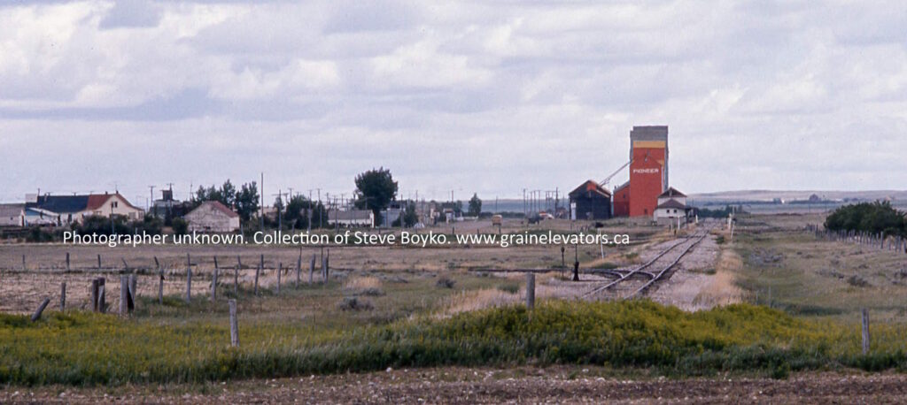 Long distance view of Acadia Valley and its grain elevators