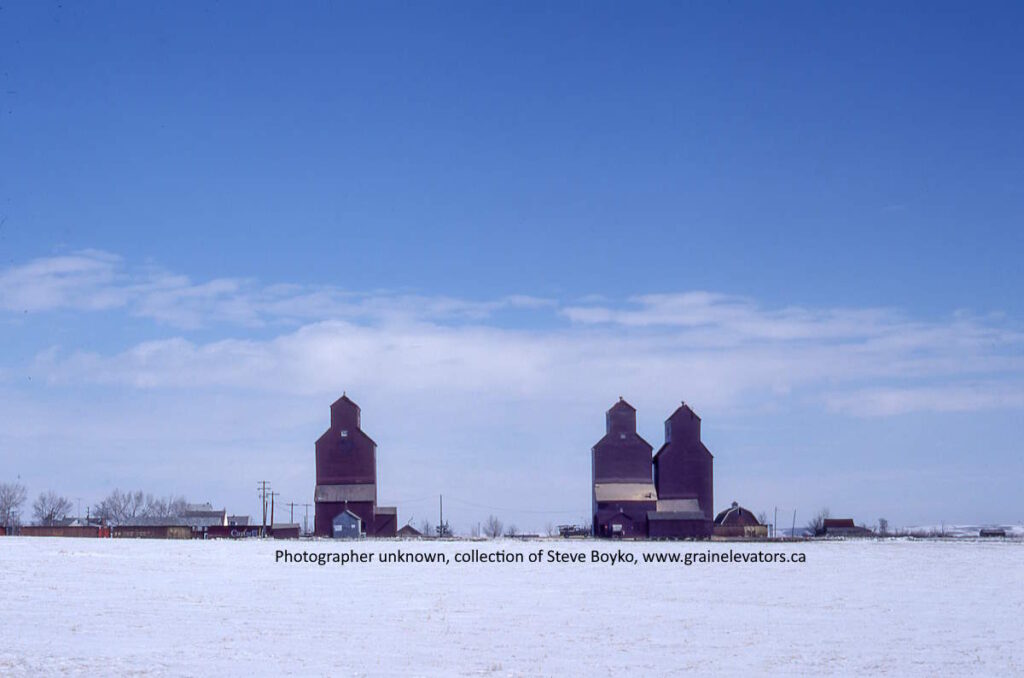 Silhouette of grain elevators on a winter prairie scene