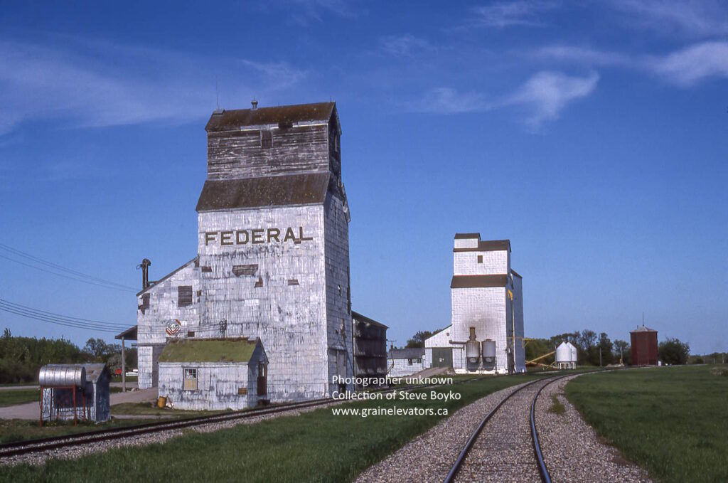 Grain elevators by railway tracks