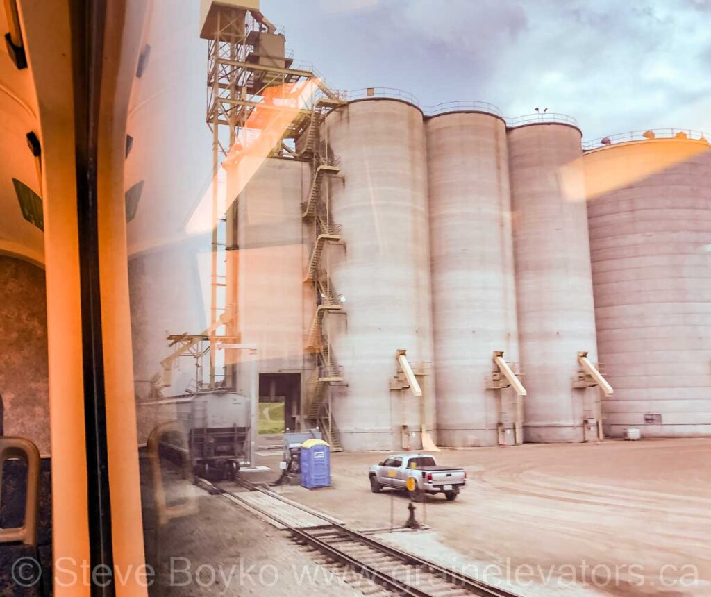 Concrete grain silos viewed from a train