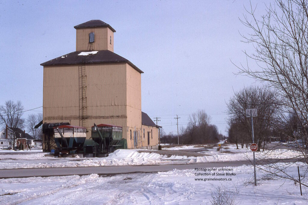 Square tan grain elevator in winter