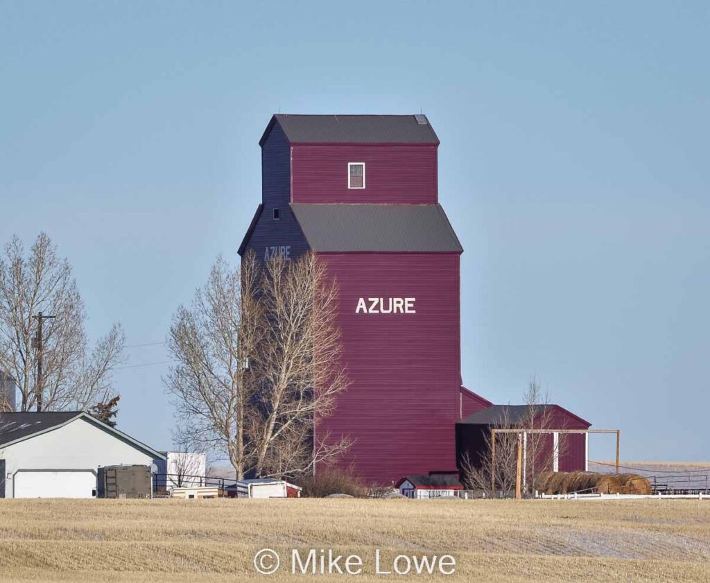 Brown grain elevator with the word AZURE on the side