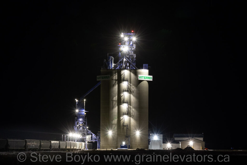 Concrete grain elevator at night