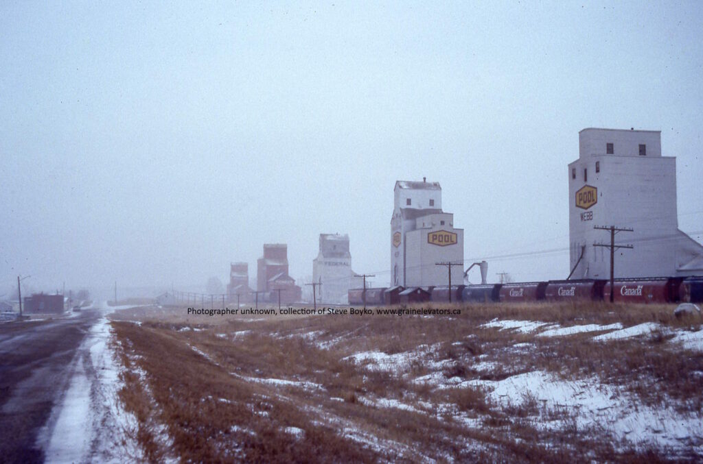 Wooden grain elevators on a snowy day