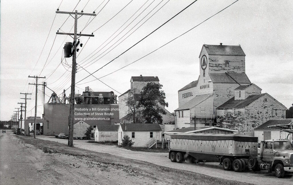 Wooden grain elevators and grain trucks in Nipawin Saskatchewan